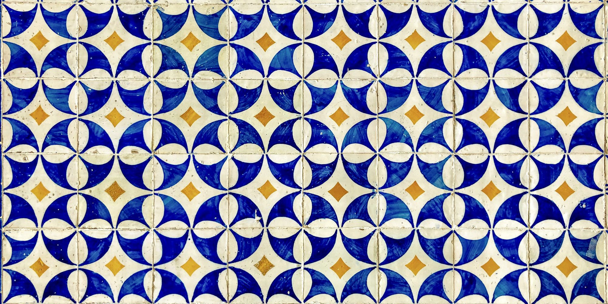 Beautiful Portuguese tiles with a deep blue and yellow motif.jpg